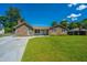 Well-maintained home showcasing a lush lawn and a classic brick exterior at 127 Rahway Rd, Goose Creek, SC 29445