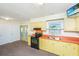 Kitchen with bright cabinets, black appliances, and double doors to a sunroom at 127 Rahway Rd, Goose Creek, SC 29445