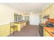 Kitchen with breakfast bar and yellow accents at 127 Rahway Rd, Goose Creek, SC 29445