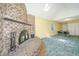 Living room featuring a brick fireplace and skylight at 127 Rahway Rd, Goose Creek, SC 29445
