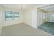 Inviting living room with a large window and neutral carpet adjacent to the entry way at 127 Rahway Rd, Goose Creek, SC 29445