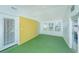 Sunroom featuring multiple windows and a yellow brick accent wall at 127 Rahway Rd, Goose Creek, SC 29445