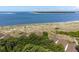 Overhead shot of a condo community situated near beach and lush greenery at 1334 Pelican Watch Villas, Seabrook Island, SC 29455