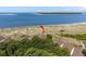 Aerial view of beautiful oceanfront property featuring lush foliage and sandy beach access at 1334 Pelican Watch Villas, Seabrook Island, SC 29455
