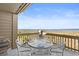This balcony offers ocean views, furnished with a cozy dining set for relaxing and dining al fresco at 1334 Pelican Watch Villas, Seabrook Island, SC 29455