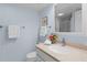 Cozy bathroom featuring a granite-topped vanity, fresh flowers, and neutral wall paint at 1334 Pelican Watch Villas, Seabrook Island, SC 29455