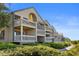 Attractive condominium exterior with multi-level balconies and lush greenery, providing a serene setting at 1334 Pelican Watch Villas, Seabrook Island, SC 29455