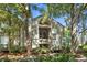 This home boasts a charming exterior, framed by mature trees and lush, vibrant landscaping at 1334 Pelican Watch Villas, Seabrook Island, SC 29455