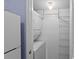 Convenient laundry room with a stackable washer and dryer unit and wire shelving at 1334 Pelican Watch Villas, Seabrook Island, SC 29455