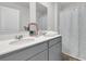 Bathroom features double sinks, gray cabinets, a mirror, and shower tub combination at 134 Ivory Shadow Rd, Summerville, SC 29486