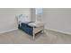 Bright bedroom featuring a cozy bed with charming blue accents and natural light from the nearby window at 134 Ivory Shadow Rd, Summerville, SC 29486