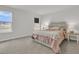 Bright bedroom with a cozy bed, neutral colors, and views of the lake from the window at 134 Ivory Shadow Rd, Summerville, SC 29486