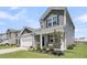 Charming two-story home with a landscaped front yard and an attached garage in a suburban neighborhood at 134 Ivory Shadow Rd, Summerville, SC 29486
