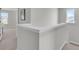Bright hallway with a staircase, neutral walls and carpet, with ample light and neighborhood views at 134 Ivory Shadow Rd, Summerville, SC 29486