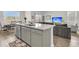 Modern kitchen island with granite countertops, stainless steel dishwasher, and an open view to the living area at 134 Ivory Shadow Rd, Summerville, SC 29486