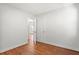 Spacious bedroom shows neutral walls, wood floor and two white doors at 1430 E Montague Ave, North Charleston, SC 29405