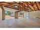 Detached garage has exposed beams and concrete floor at 1430 E Montague Ave, North Charleston, SC 29405