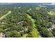Aerial view of a lush, green, golf community surrounded by trees at 146 High Hammock Villas, Seabrook Island, SC 29455