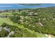 Scenic aerial view showcases homes in a verdant golf community near the ocean at 146 High Hammock Villas, Seabrook Island, SC 29455