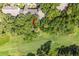 Aerial view showcasing the property next to the golf course, amidst trees at 146 High Hammock Villas, Seabrook Island, SC 29455