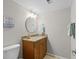 Bathroom includes a vanity, decorative mirror, and nautical themed decor, offering a refreshing space at 146 High Hammock Villas, Seabrook Island, SC 29455