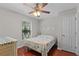 Cozy bedroom with ceiling fan, a window, and a comfortable bed, creating a relaxing space at 146 High Hammock Villas, Seabrook Island, SC 29455