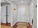 Clean entryway with hardwood floors, white doors, and neutral paint, offering a welcoming entrance at 146 High Hammock Villas, Seabrook Island, SC 29455