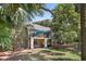 Serene condo exterior featuring a balcony and patio nestled among mature trees at 146 High Hammock Villas, Seabrook Island, SC 29455