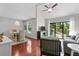 Open living area showcasing a dining table, comfortable seating, and a sliding glass door to the outside at 146 High Hammock Villas, Seabrook Island, SC 29455