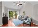 Cozy living room featuring hardwood floors, comfortable seating, and a sliding glass door to the outside at 146 High Hammock Villas, Seabrook Island, SC 29455