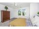 Bedroom with carpet, ceiling fan, and a view of the outdoors from the window at 1529 Foster Creek Rd, Hanahan, SC 29410