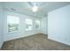 Bright and airy bedroom with neutral carpet, white trim, and three windows at 1529 Foster Creek Rd, Hanahan, SC 29410
