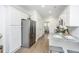 Modern kitchen featuring granite countertops, stainless steel appliances, and white cabinetry at 1529 Foster Creek Rd, Hanahan, SC 29410