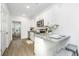 Modern kitchen featuring granite countertops, stainless steel appliances, and white cabinetry at 1529 Foster Creek Rd, Hanahan, SC 29410