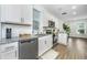 Modern kitchen with granite countertops, stainless steel appliances, and white cabinetry at 1529 Foster Creek Rd, Hanahan, SC 29410