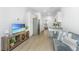 Living room featuring modern decor, hardwood floors, and stainless steel refrigerator at 1529 Foster Creek Rd, Hanahan, SC 29410