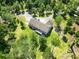 An aerial view of a home with a deck surrounded by lush greenery and trees at 153 Willow Brook Way, Cordesville, SC 29434
