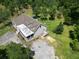 An aerial view of a home with a screened in porch, deck and trees at 153 Willow Brook Way, Cordesville, SC 29434