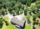 An aerial view of a home with a deck surrounded by lush greenery, ponds and trees at 153 Willow Brook Way, Cordesville, SC 29434