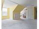 A bright attic room with a window, built-in shelving, and a closet door at 153 Willow Brook Way, Cordesville, SC 29434