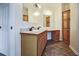 Bathroom with a double vanity, decorative mirrors, and a built-in dressing table at 153 Willow Brook Way, Cordesville, SC 29434
