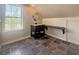 Attic bathroom featuring a vanity with a round mirror and a dark built in desk at 153 Willow Brook Way, Cordesville, SC 29434