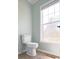 Bright bathroom with a toilet next to a window, providing natural light and ventilation at 153 Willow Brook Way, Cordesville, SC 29434