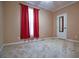 Bedroom with neutral walls, carpeted floor, red curtains and a white door with a mirror at 153 Willow Brook Way, Cordesville, SC 29434