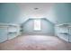 Light-filled bonus room with custom storage and shelving, perfect for a home office or playroom at 153 Willow Brook Way, Cordesville, SC 29434