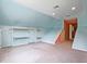Spacious bonus room with a window, carpeted floor and built in storage units at 153 Willow Brook Way, Cordesville, SC 29434