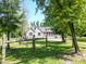 Picturesque view of a home with a screened-in porch, complemented by a rustic wooden fence at 153 Willow Brook Way, Cordesville, SC 29434