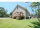 Rear exterior view of home and backyard at 153 Willow Brook Way, Cordesville, SC 29434