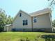 Back of house featuring neutral siding, brick foundation, and a storage shed at 153 Willow Brook Way, Cordesville, SC 29434