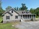 Well-maintained home with a charming screened-in porch and meticulously landscaped yard at 153 Willow Brook Way, Cordesville, SC 29434